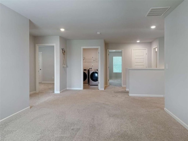 3062 Hawthorn Farm Blvd, Loganville, GA 30052 - unfurnished living room with separate washer and dryer, light carpet, baseboards, and recessed lighting