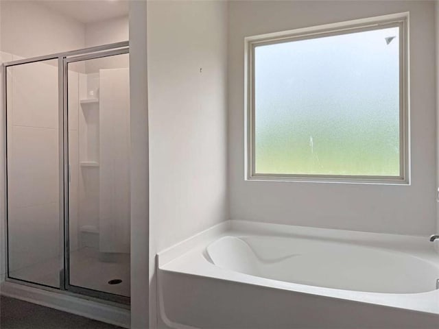 3062 Hawthorn Farm Blvd, Loganville, GA 30052 - full bath featuring a shower stall and a garden tub
