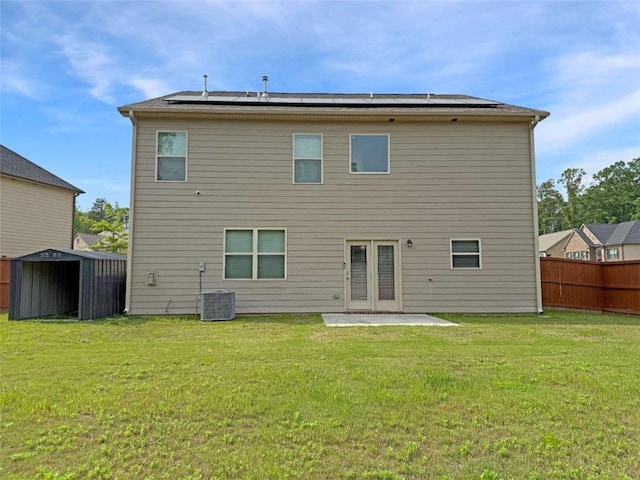 3062 Hawthorn Farm Blvd, Loganville, GA 30052 - rear view of property with a patio area, solar panels, and central air condition unit