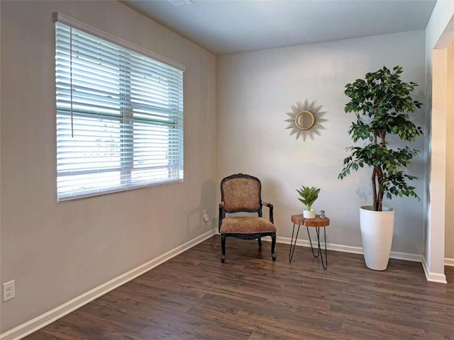 3062 Hawthorn Farm Blvd, Loganville, GA 30052 - sitting room featuring dark wood finished floors and baseboards
