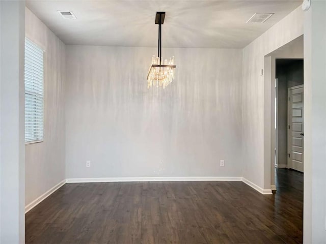 3062 Hawthorn Farm Blvd, Loganville, GA 30052 - unfurnished room with dark wood finished floors, a chandelier, baseboards, and a smoke detector
