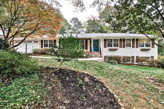 view of front facade with a garage and a front lawn