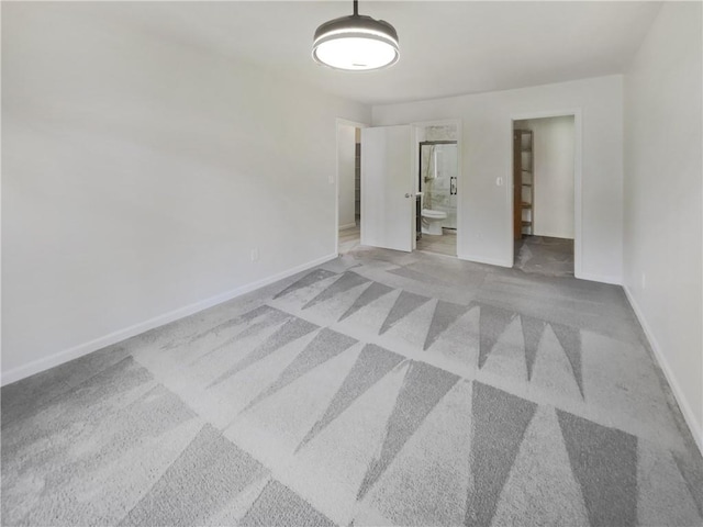 unfurnished room with light carpet