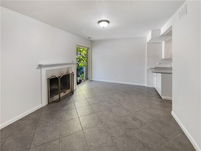 unfurnished living room with tile patterned floors