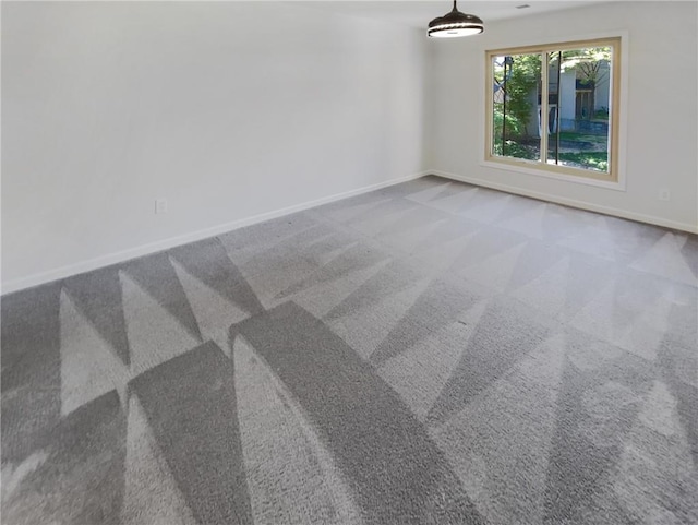 unfurnished room with light colored carpet