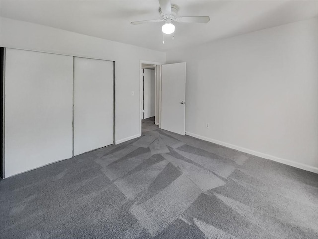 unfurnished bedroom featuring a closet, ceiling fan, and carpet floors