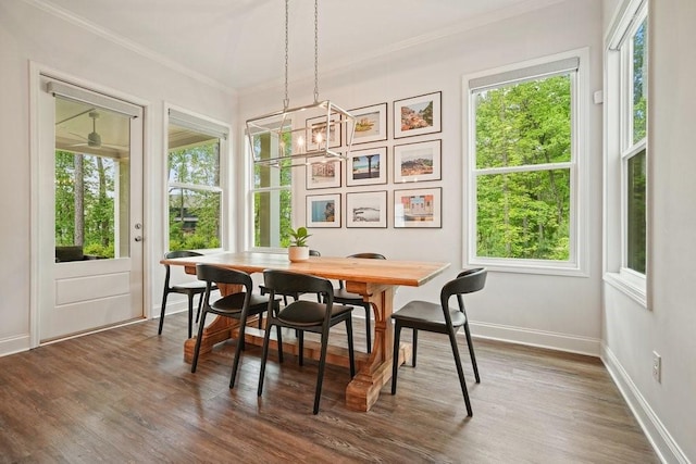 sunroom featuring a healthy amount of sunlight and a chandelier