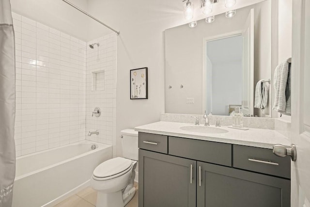 full bathroom featuring vanity, tile patterned floors, shower / bath combination with curtain, and toilet