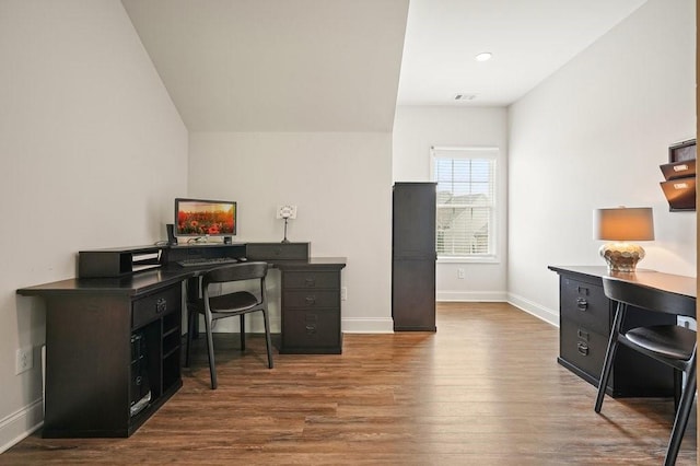 home office featuring baseboards, wood finished floors, and visible vents