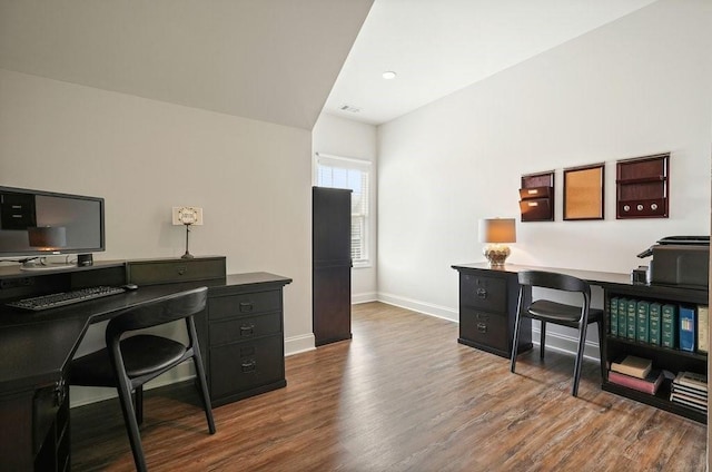 home office featuring baseboards, wood finished floors, and visible vents