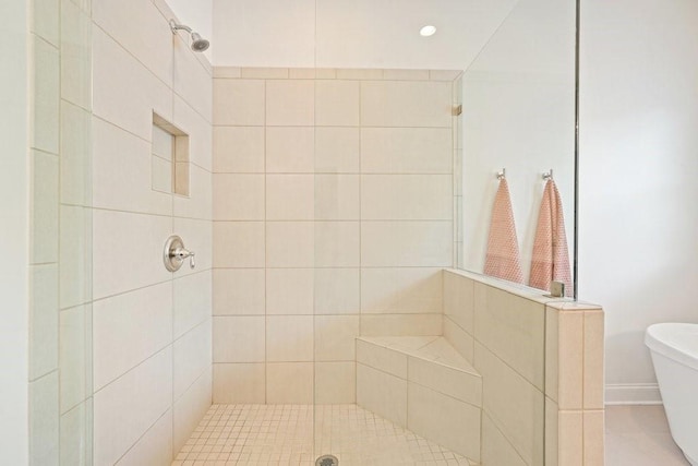 bathroom with tiled shower