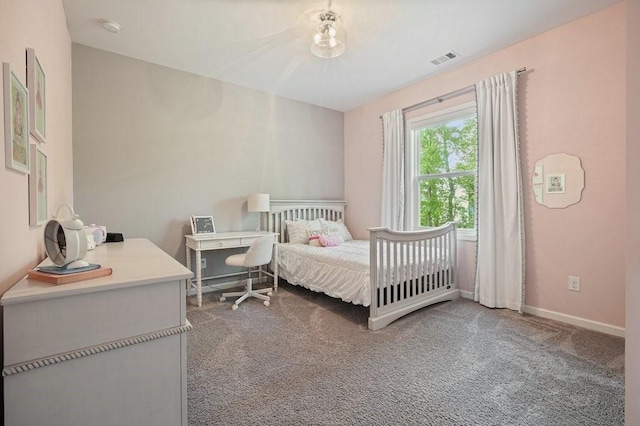 bedroom featuring visible vents, baseboards, and carpet floors