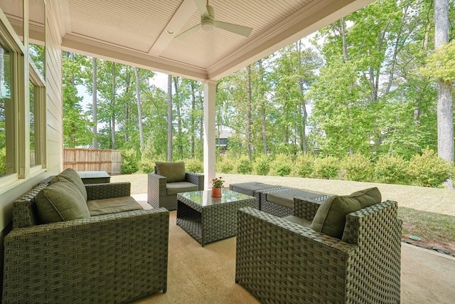 view of patio / terrace with fence, ceiling fan, and an outdoor living space