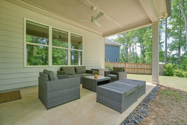 view of patio / terrace featuring fence, ceiling fan, and outdoor lounge area