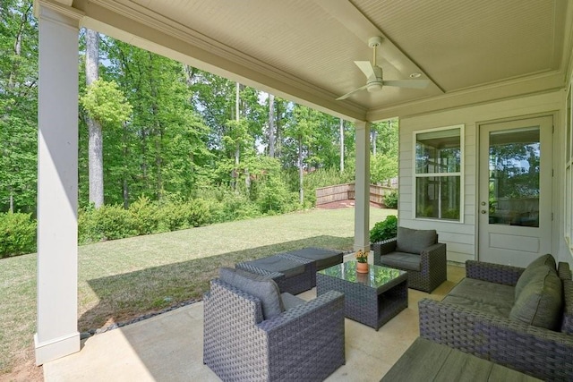 view of patio with an outdoor living space and ceiling fan