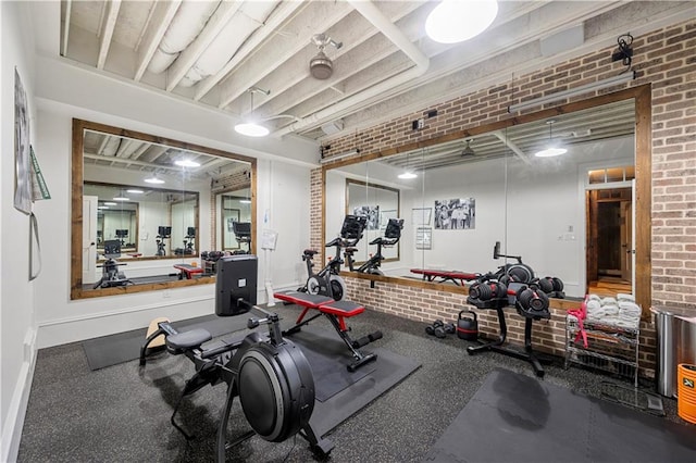 61 Alden Ave NW, Atlanta, GA 30309 - exercise room featuring brick wall and baseboards