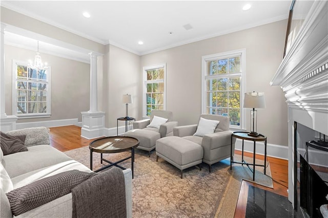 61 Alden Ave NW, Atlanta, GA 30309 - living area with ornate columns, wood finished floors, recessed lighting, a fireplace, and ornamental molding