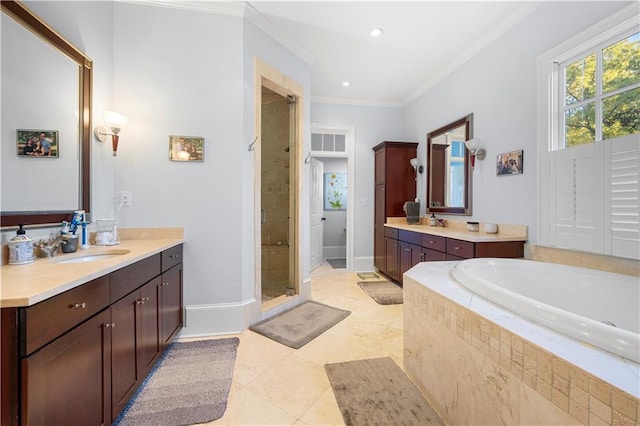 61 Alden Ave NW, Atlanta, GA 30309 - bathroom with a shower stall, ornamental molding, vanity, a garden tub, and tile patterned floors