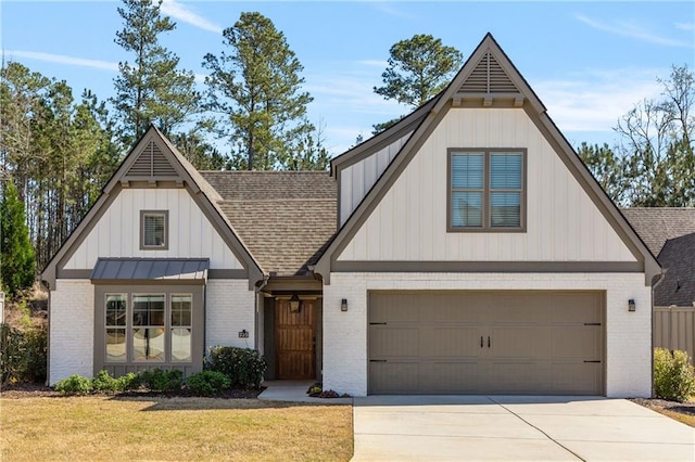 modern farmhouse featuring brick siding, concrete driveway, a shingled roof, and a front lawn