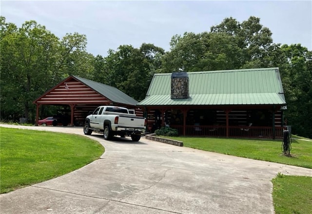 2969 Poplar Springs Rd, Buchanan, GA 30113 - view of parking with concrete driveway and a carport