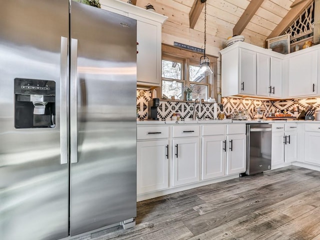 kitchen featuring white cabinetry, wood ceiling, lofted ceiling with beams, hanging light fixtures, and stainless steel appliances