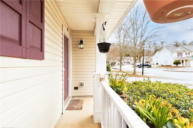 balcony with a residential view and a porch