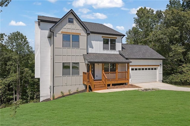 view of front facade with a garage and a front lawn