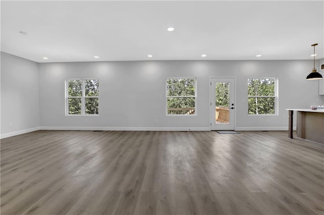 unfurnished living room with hardwood / wood-style flooring