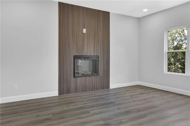 unfurnished living room featuring hardwood / wood-style floors