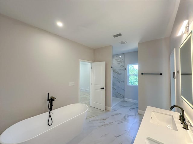 bathroom with vanity and independent shower and bath