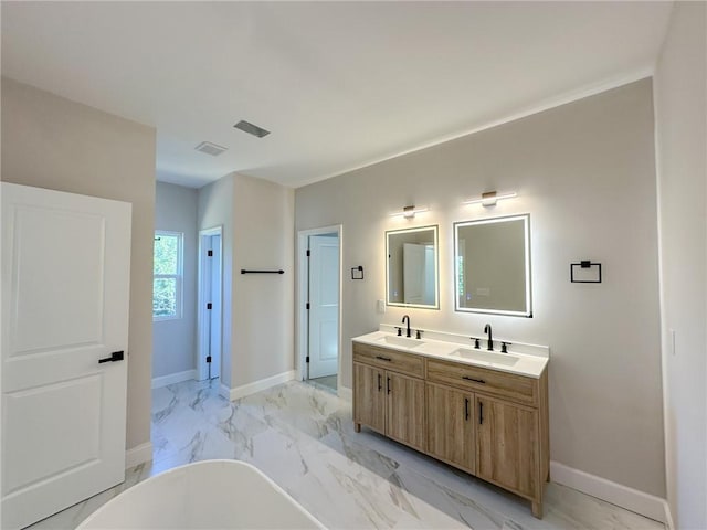 bathroom featuring a tub and vanity