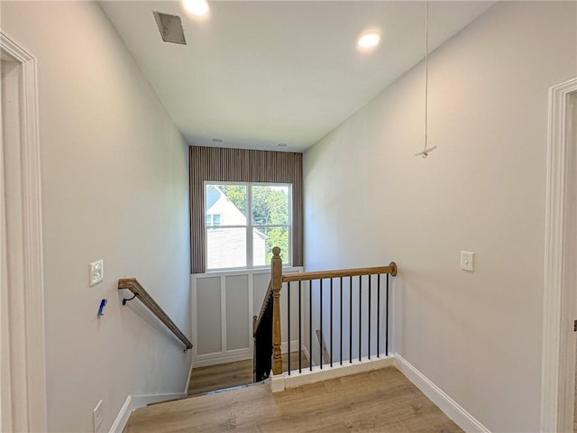 stairway featuring hardwood / wood-style flooring