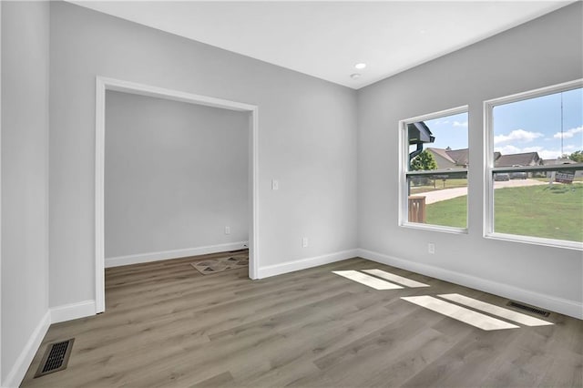 empty room featuring wood-type flooring