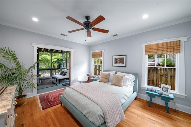 bedroom with visible vents, access to exterior, and light wood finished floors