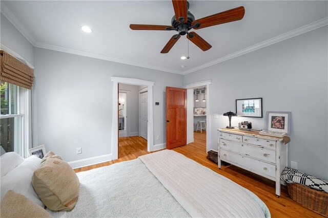 bedroom featuring crown molding, wood finished floors, baseboards, ceiling fan, and recessed lighting