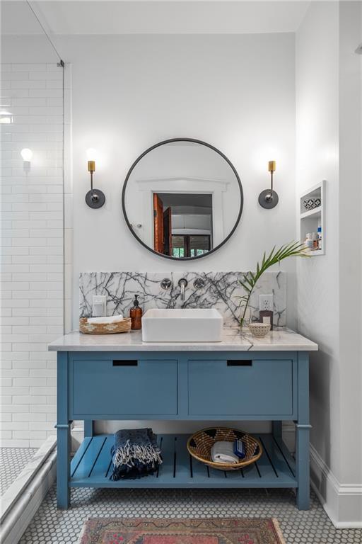 bathroom with vanity, tile patterned flooring, and a shower stall