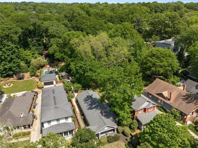drone / aerial view with a view of trees and a residential view