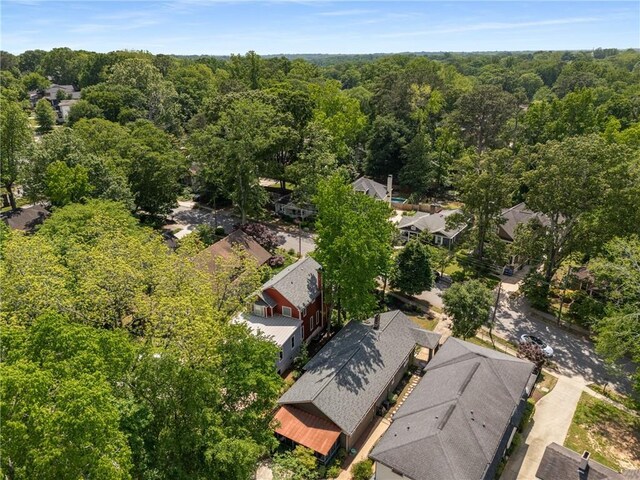 aerial view featuring a forest view and a residential view