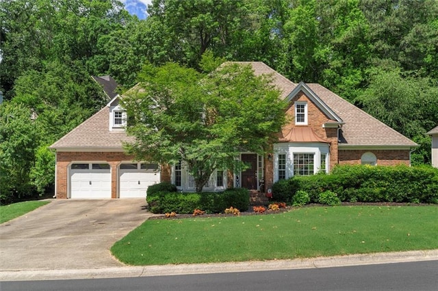4381 Laurian Dr NW, Kennesaw, GA 30144 - view of front of house featuring concrete driveway, a front yard, brick siding, and a garage