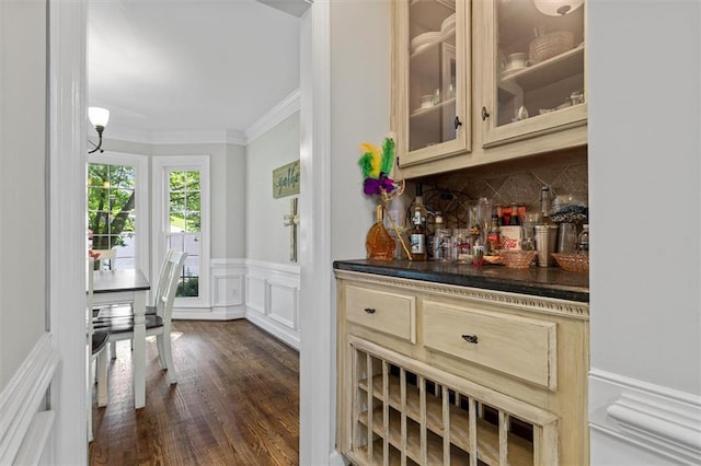 4381 Laurian Dr NW, Kennesaw, GA 30144 - indoor dry bar with crown molding, backsplash, wainscoting, a decorative wall, and dark wood-type flooring