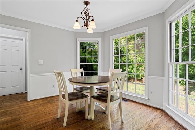 4381 Laurian Dr NW, Kennesaw, GA 30144 - dining space featuring a chandelier, wood finished floors, ornamental molding, and baseboards