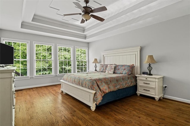 4381 Laurian Dr NW, Kennesaw, GA 30144 - bedroom featuring wood finished floors, baseboards, multiple windows, a tray ceiling, and crown molding