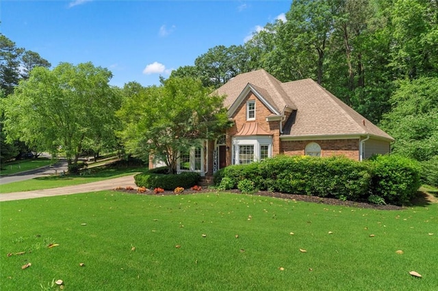 4381 Laurian Dr NW, Kennesaw, GA 30144 - view of front of house with a front yard, brick siding, and roof with shingles