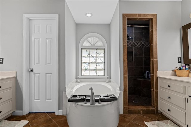 4381 Laurian Dr NW, Kennesaw, GA 30144 - bathroom with vanity, a bathtub, a stall shower, and baseboards