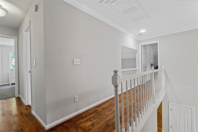 4381 Laurian Dr NW, Kennesaw, GA 30144 - hall with an upstairs landing, attic access, baseboards, ornamental molding, and wood finished floors