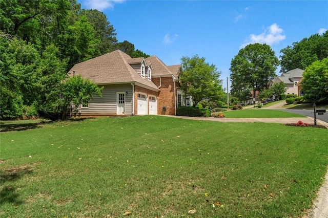 4381 Laurian Dr NW, Kennesaw, GA 30144 - view of green lawn featuring a garage