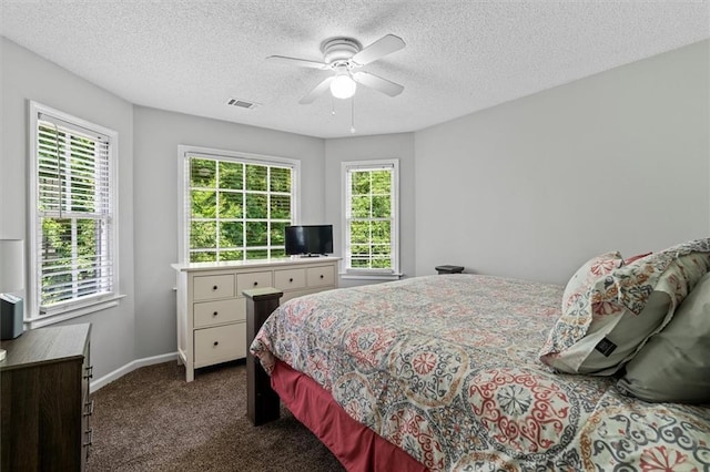 4381 Laurian Dr NW, Kennesaw, GA 30144 - carpeted bedroom with a textured ceiling, baseboards, and ceiling fan