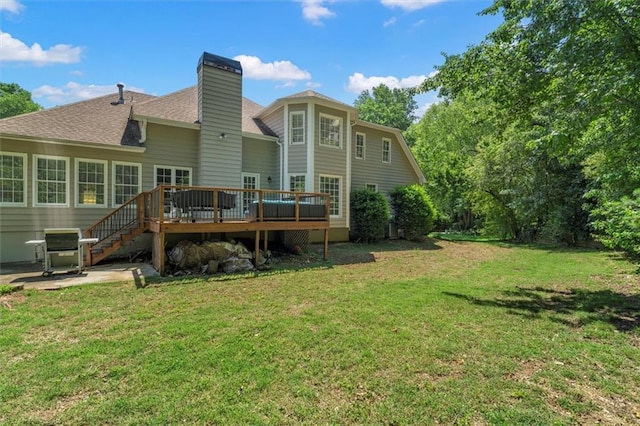 4381 Laurian Dr NW, Kennesaw, GA 30144 - back of property featuring a wooden deck, a yard, a shingled roof, a chimney, and a patio