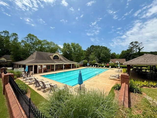 4381 Laurian Dr NW, Kennesaw, GA 30144 - community pool featuring a patio area, a gazebo, and view of wooded area