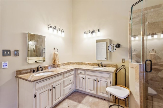 full bath featuring a shower stall and double vanity